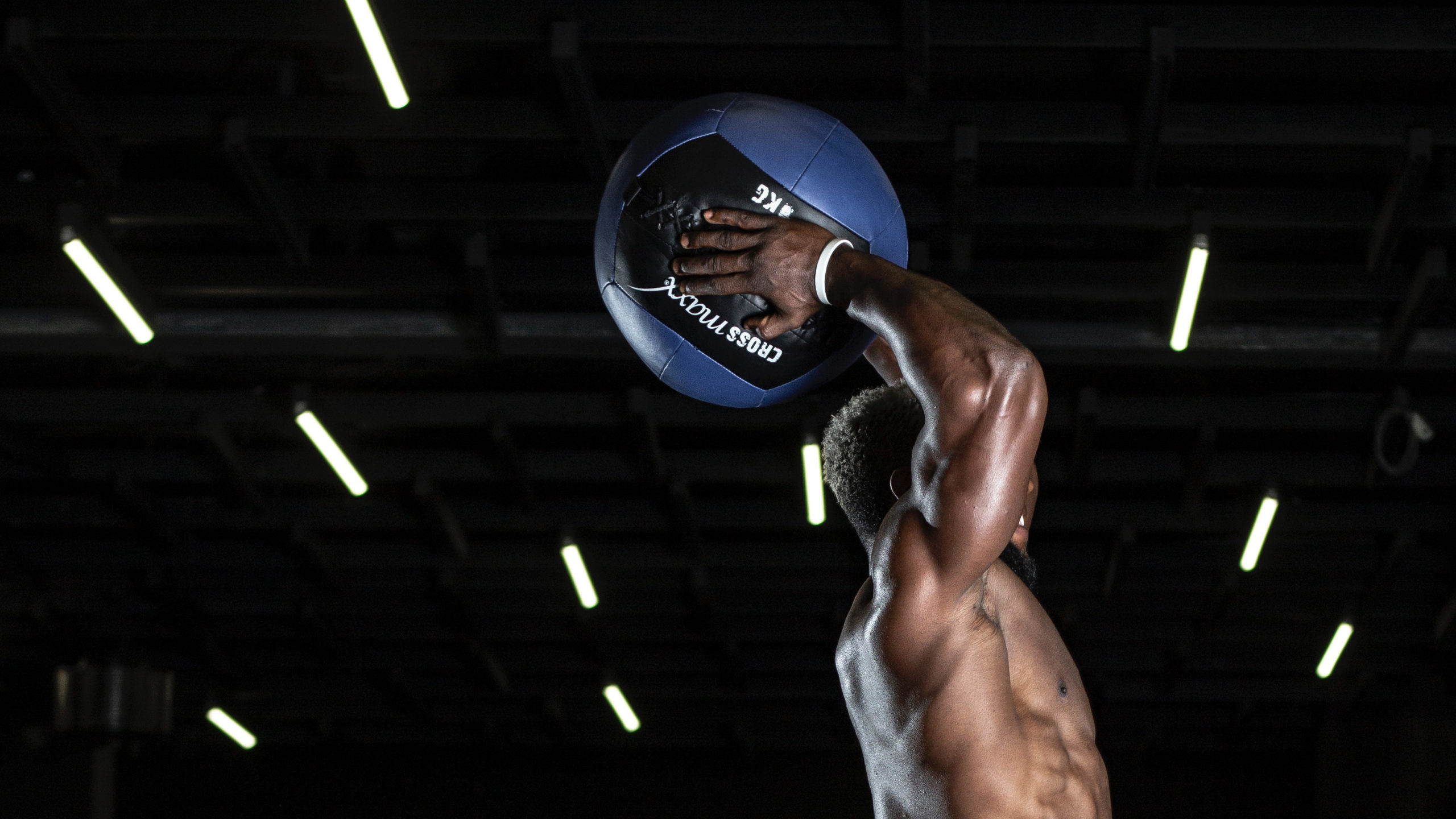 Man jumping with medicine ball
